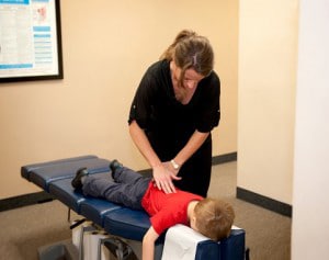 Chiropractor Powell OH Mackenzie Pamer Adjusting Child