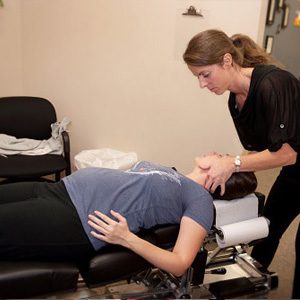 Chiropractor Powell OH Mackenzie Pamer Adjusting Pregnant Patient